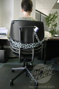 Worker Chained to Desk